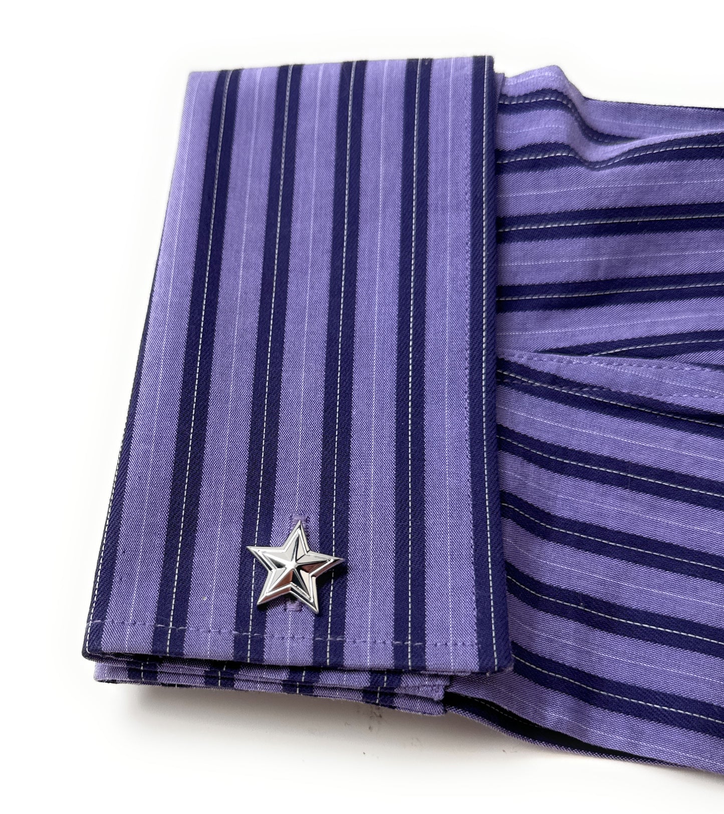 Purple striped shirt with a star-shaped cufflink on a white background