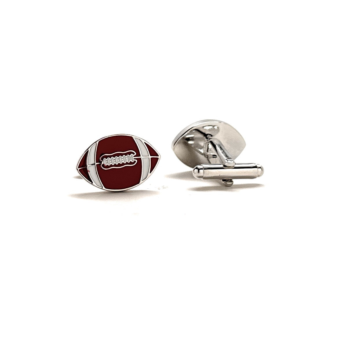 Football-shaped cufflinks on a white background