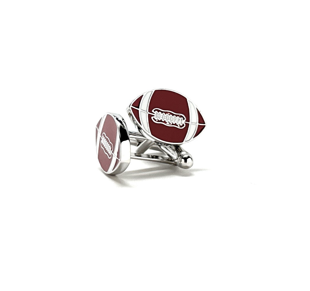 Football-shaped cufflinks with red and silver design on a white background