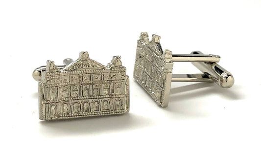 Silver architectural cufflinks on a white background