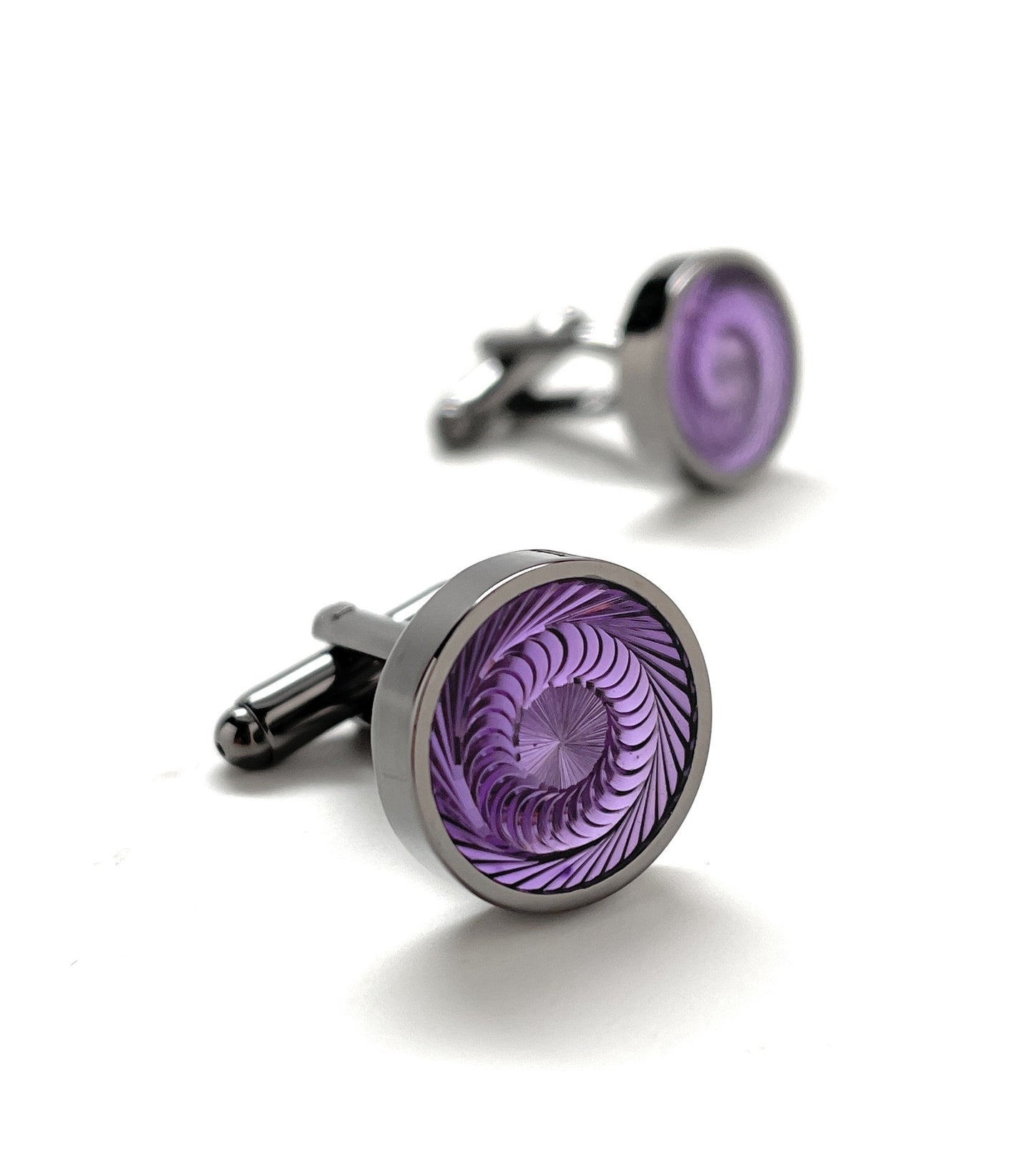 A pair of round silver and gunmetal cufflinks with a deep purple swirl pattern, known as the Purple Haze Cufflinks by JayPins, reflecting a bold and modern men’s fashion design.