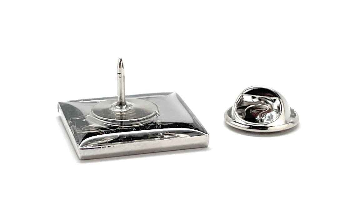 Metallic lapel pin on a white background