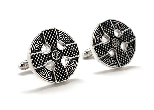 Pair of black and silver patterned cufflinks on a white background
