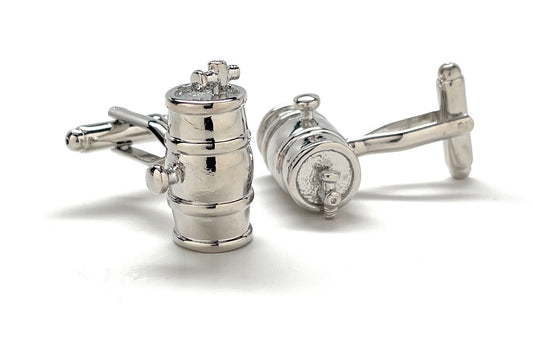 Silver cufflinks with intricate design on a white background
