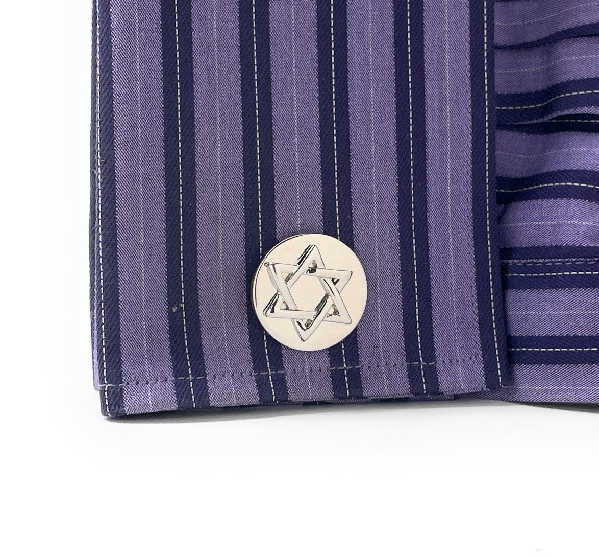 Close-up of a purple striped fabric with a Star of David emblem on a white background