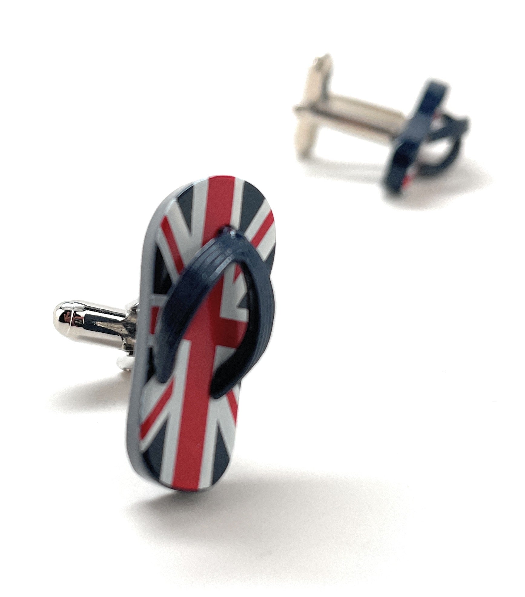 Flip-flop cufflinks with Union Jack design on a white background