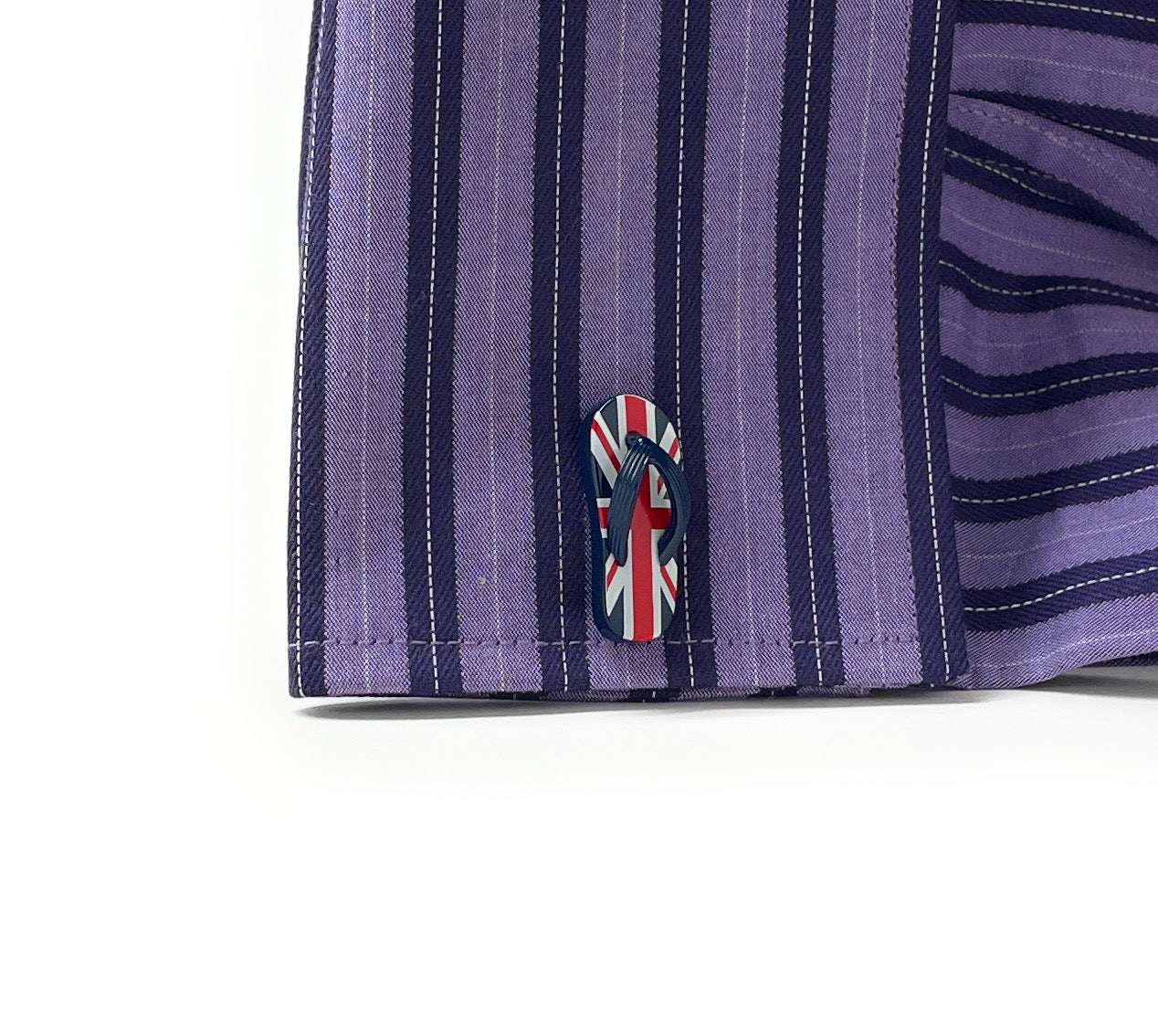 Close-up of a purple and navy striped fabric with a Union Jack logo on a white background
