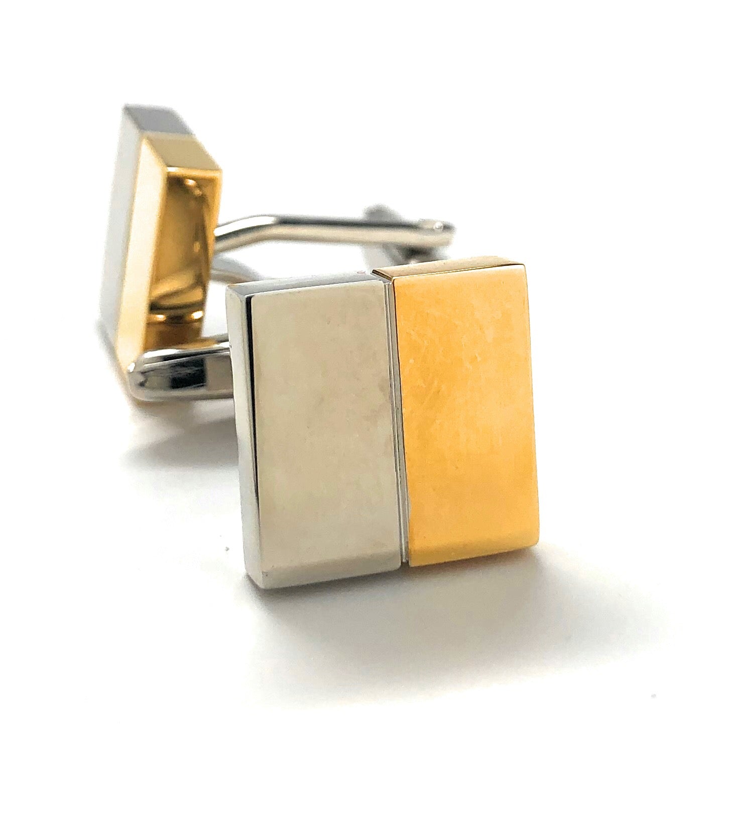 Two-tone gold and silver square cufflinks on a white background