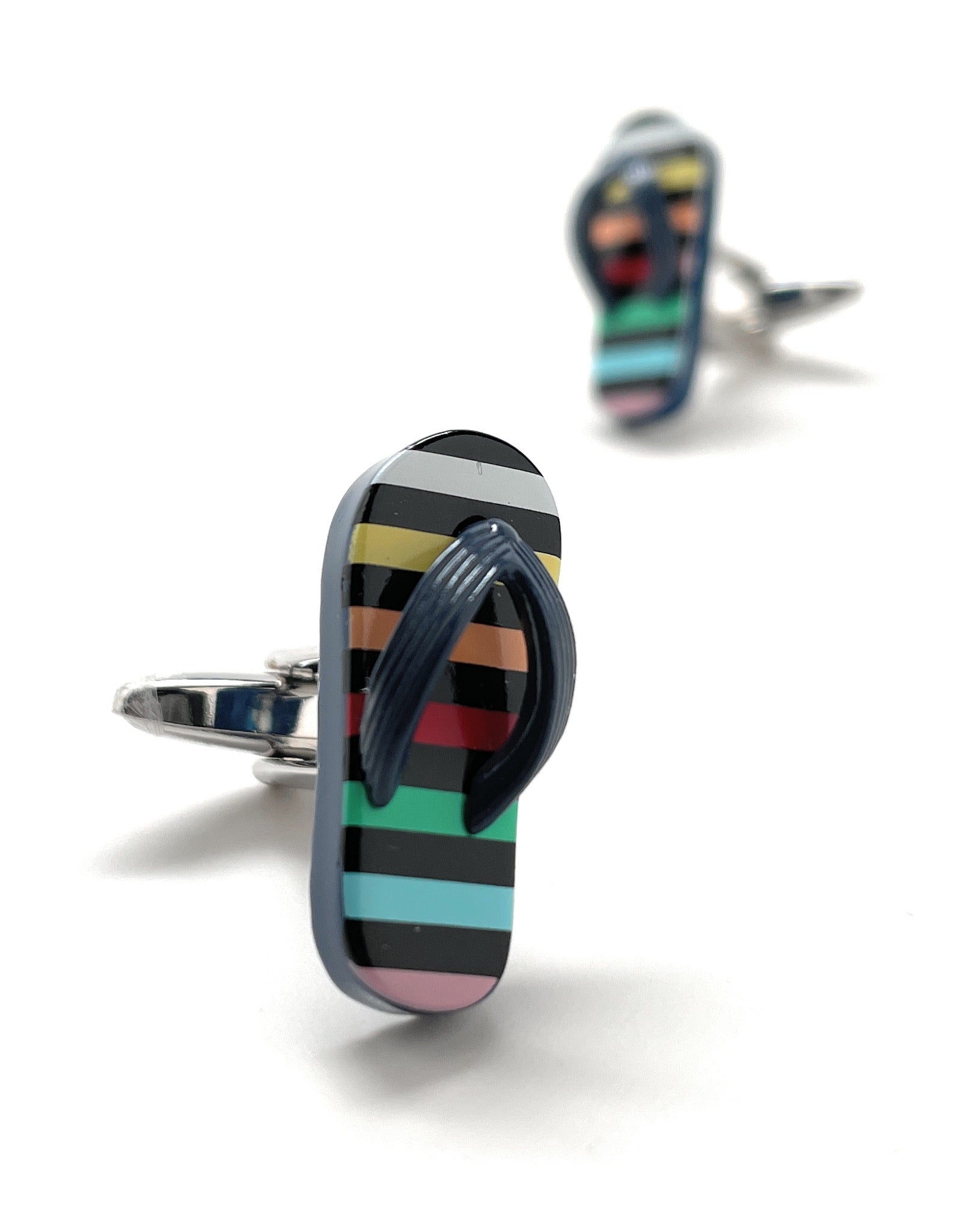 Colorful striped cufflinks on a white background