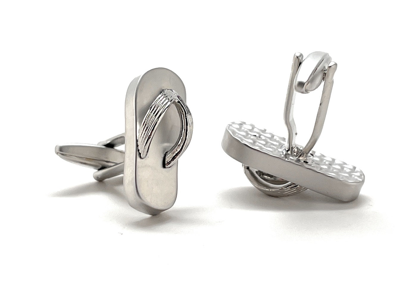 Silver flip-flop cufflinks on a white background