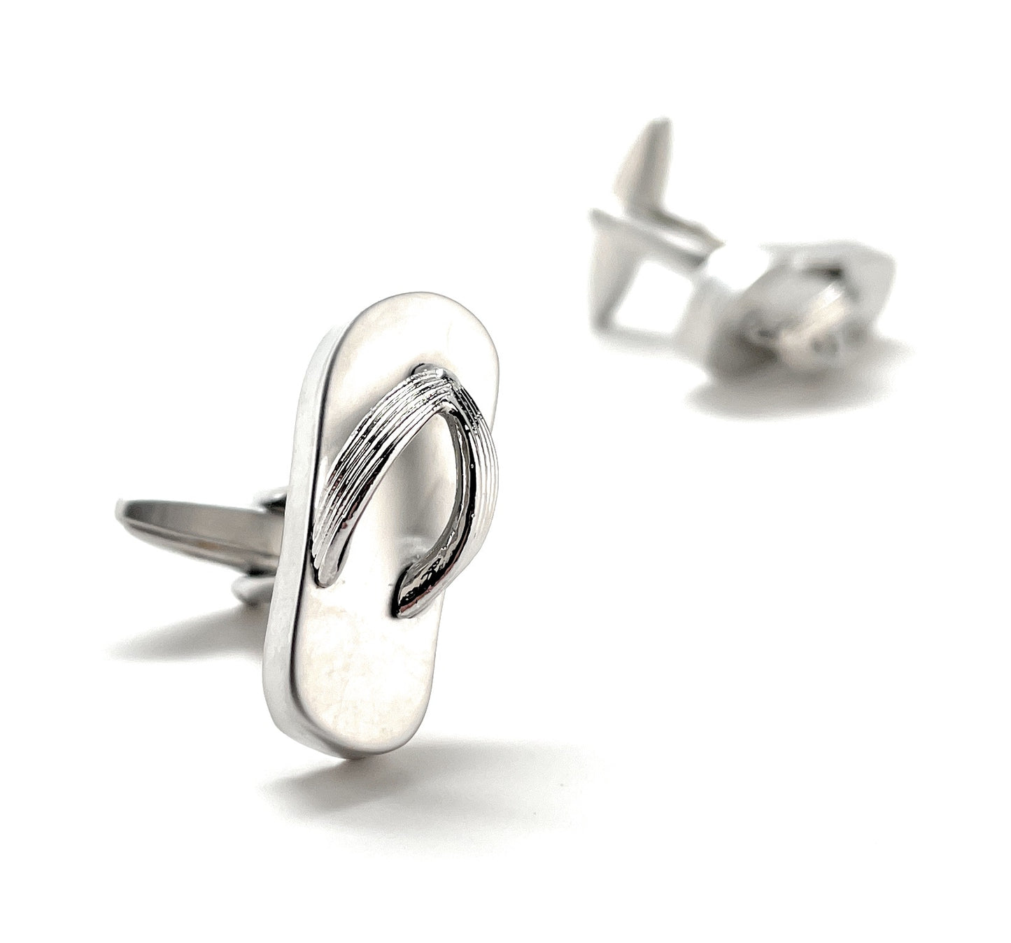 Silver flip-flop cufflinks on a white background