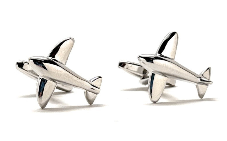 Silver airplane-shaped cufflinks on a white background