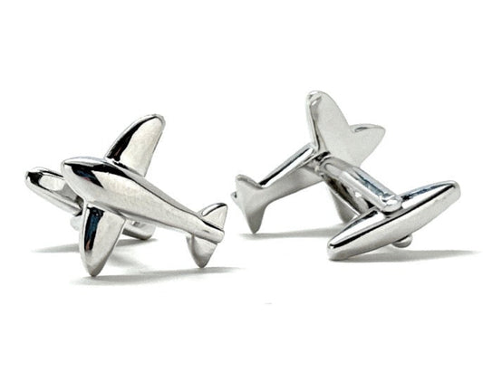 Silver airplane-shaped cufflinks on a white background