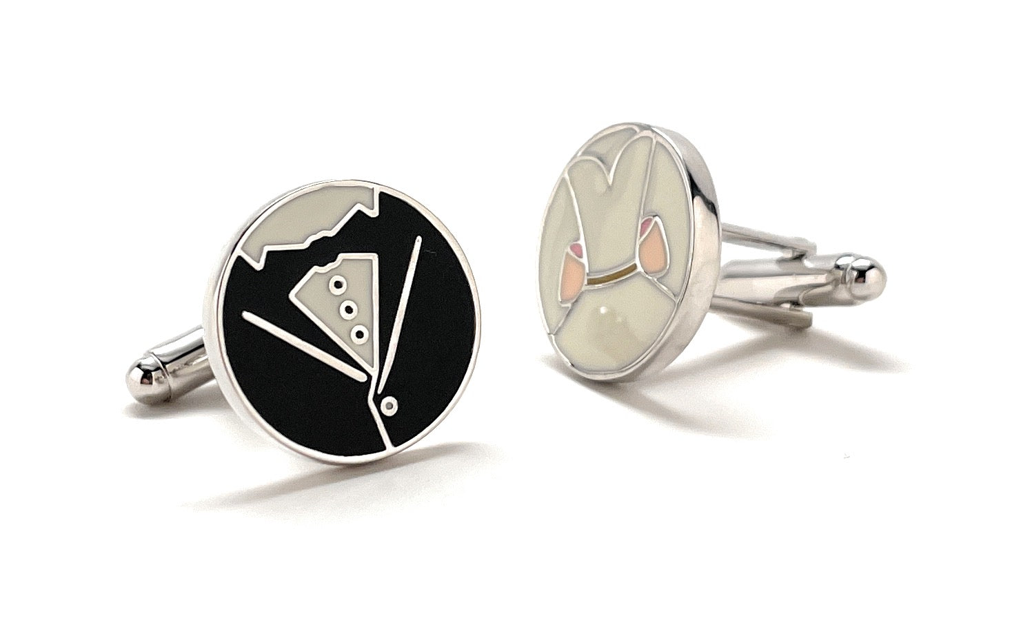 Two cufflinks with tuxedo and rabbit designs on a white background