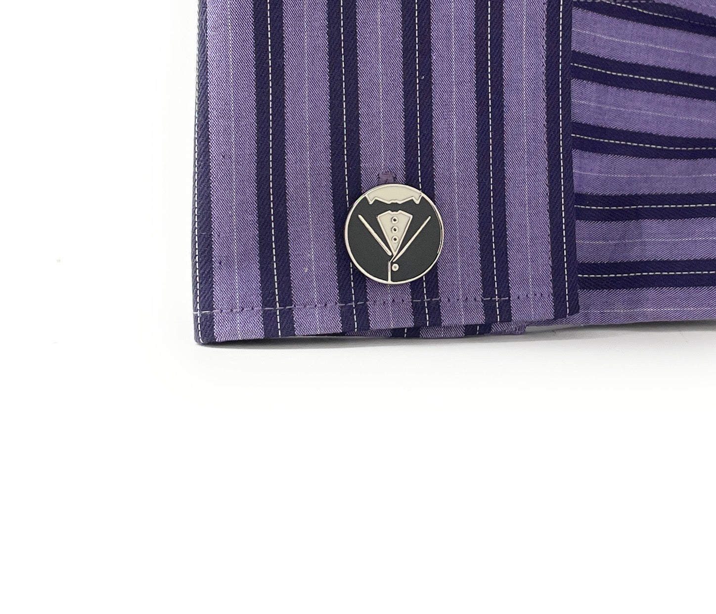 Close-up of a purple striped shirt with a logo on a white background