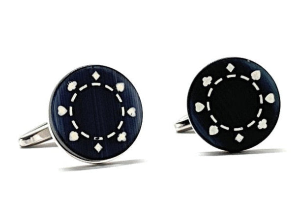 Pair of black round cufflinks with silver accents on a white background