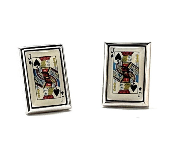 Pair of playing card cufflinks with spade design on a white background