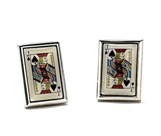 Pair of playing card cufflinks with spade design on a white background