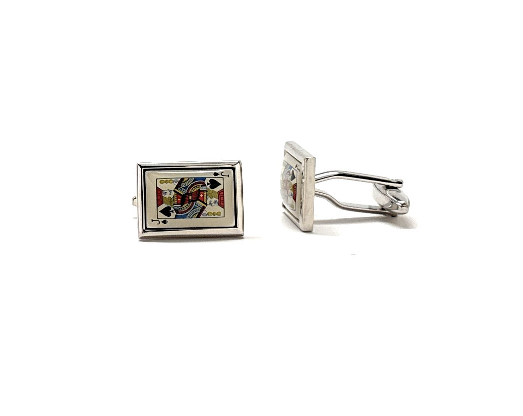 Cufflinks with a square design featuring playing card suits on a white background
