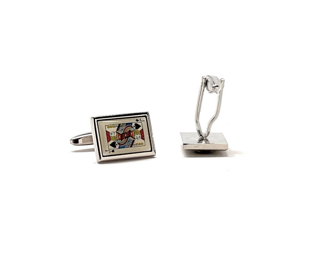 Cufflinks with a playing card design on a white background