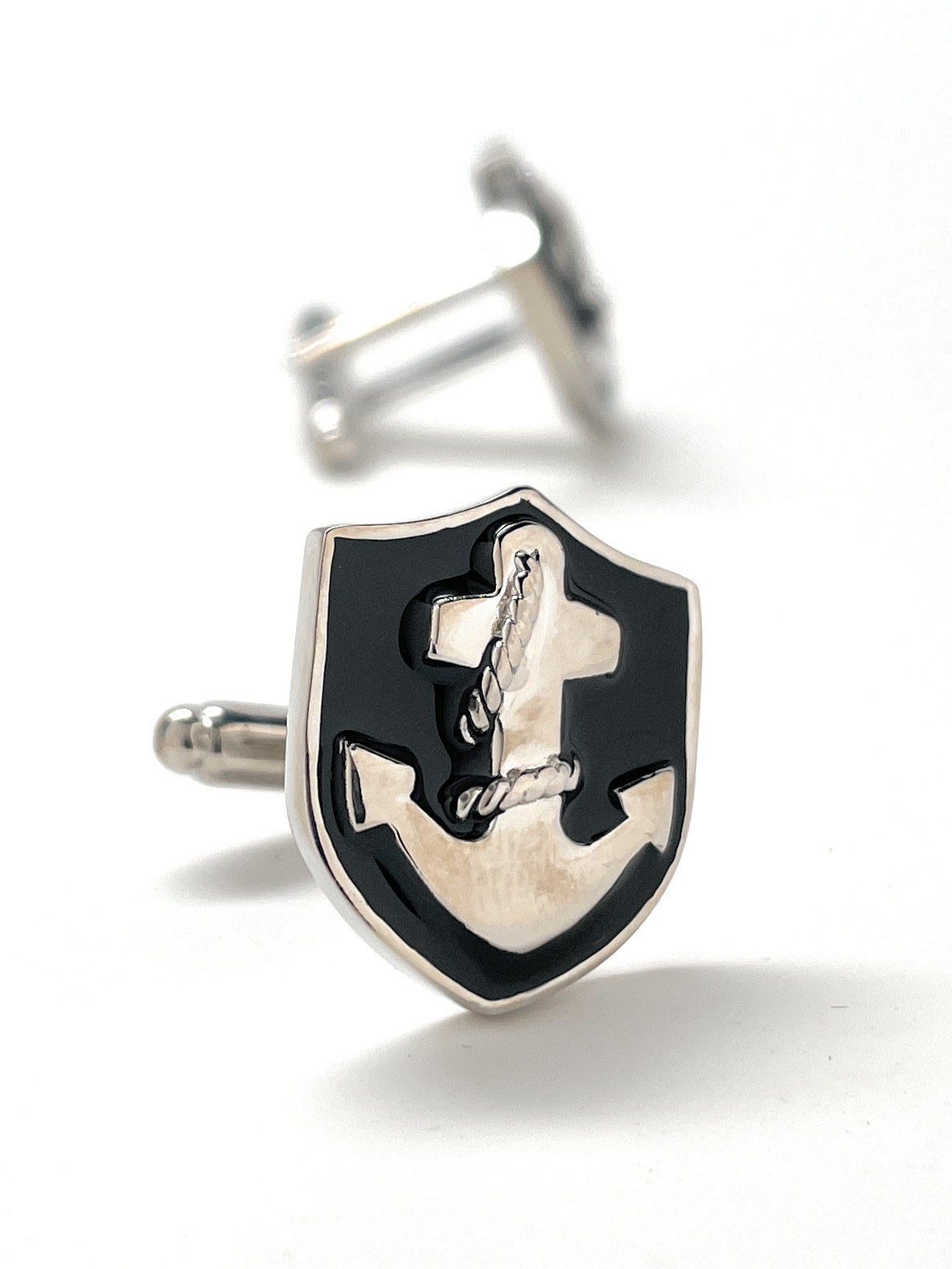 Cufflinks with anchor design on a white background