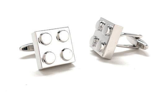 Silver square cufflinks with circular designs on a white background