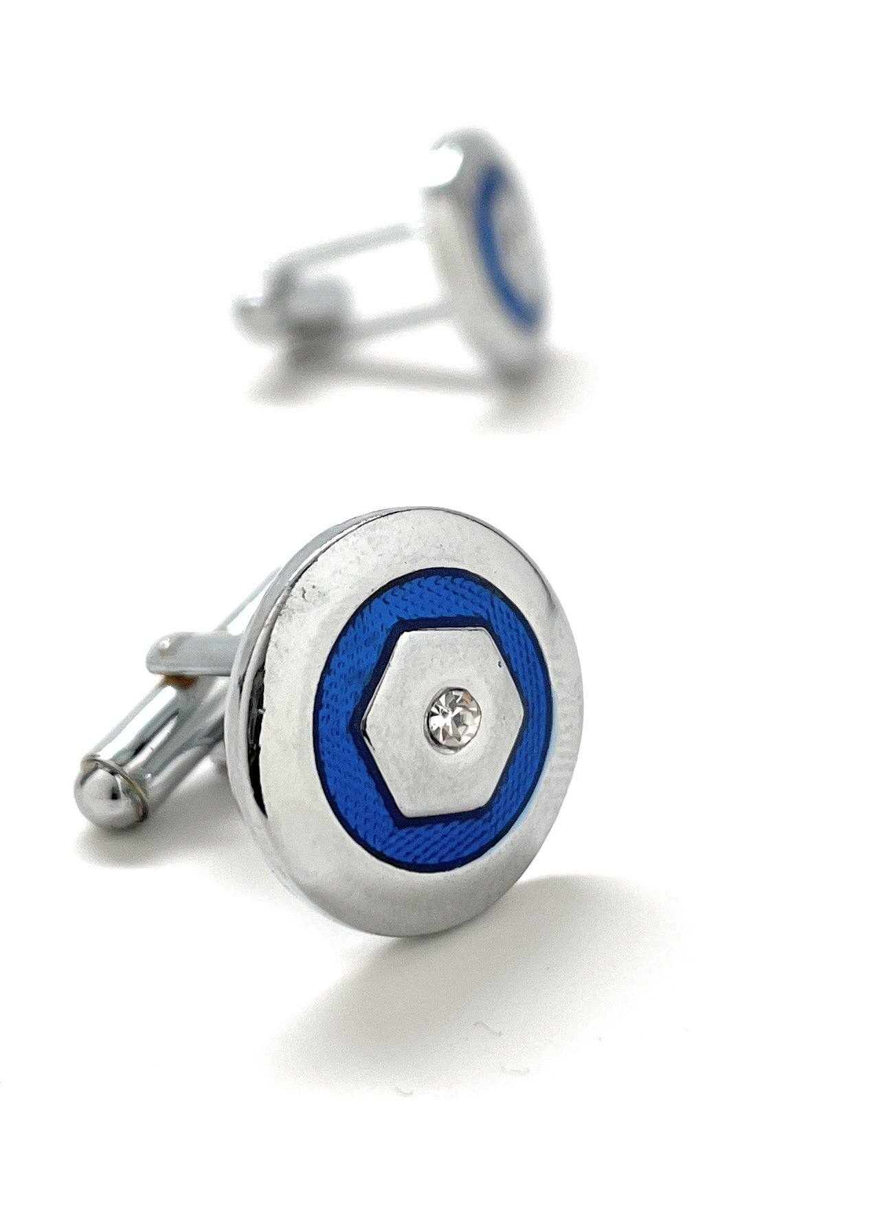 Cufflinks with blue circular design and silver accents on a white background