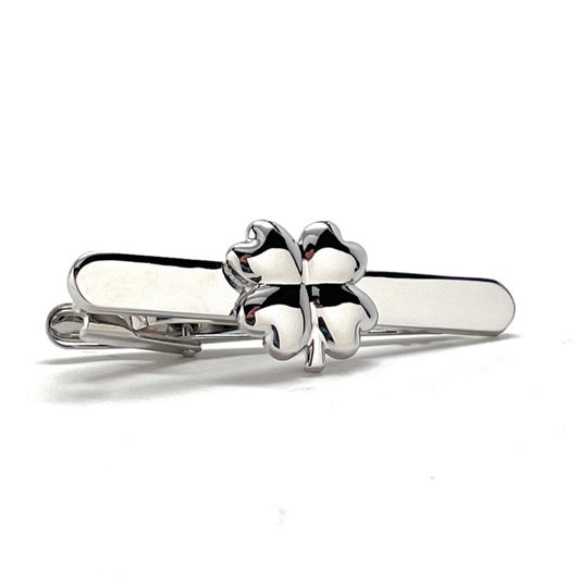 Silver four-leaf clover ring on a white background