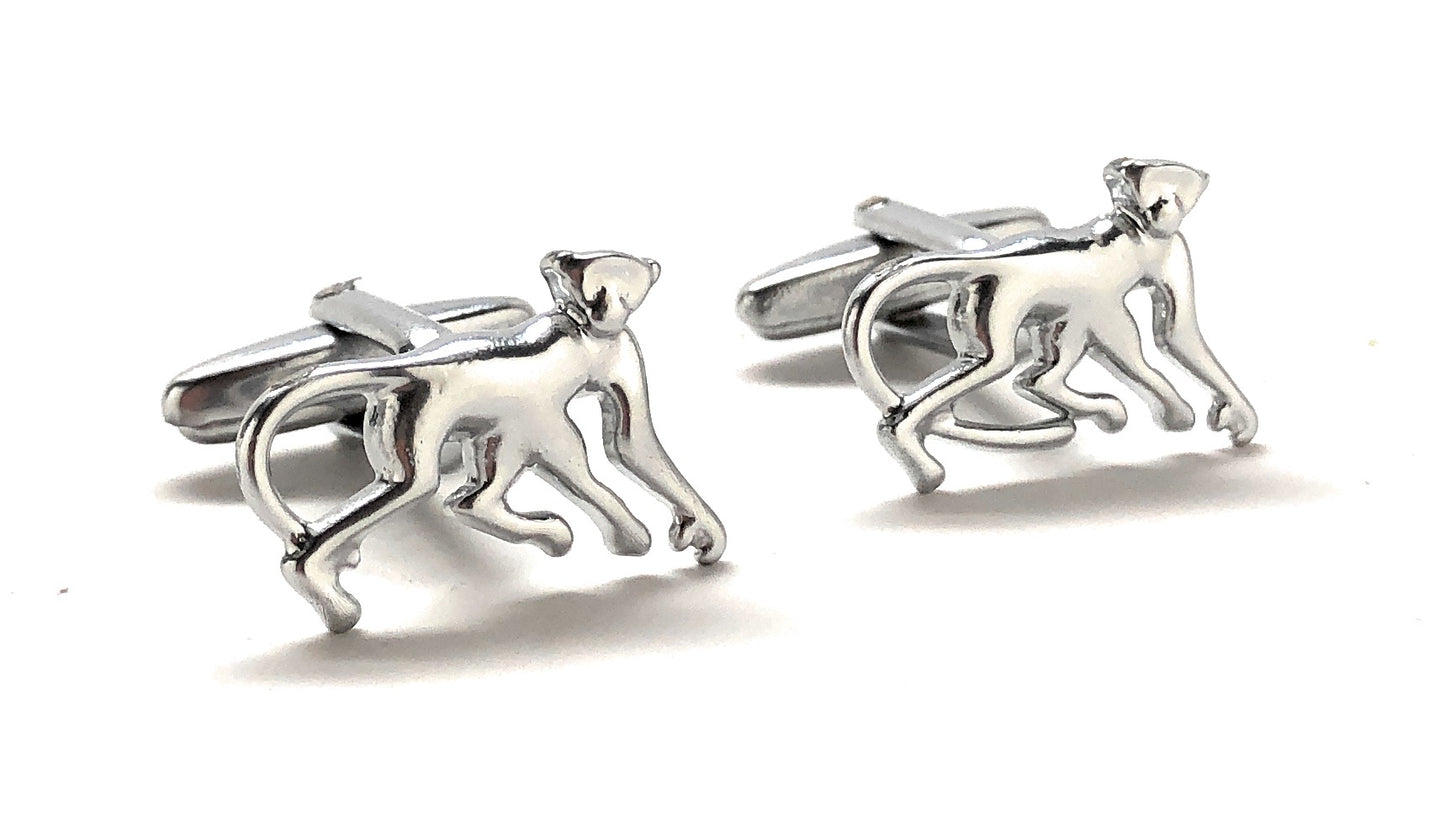 Silver monkey-shaped cufflinks on a white background