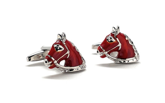 Red horse head cufflinks on a white background