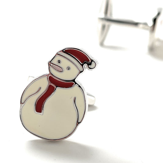 Snowman-shaped cufflinks with a red scarf and hat on a white background