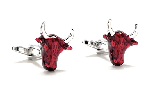 Red bull head cufflinks on a white background