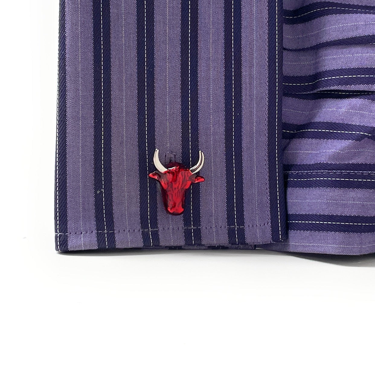 Red bull logo on a striped shirt sleeve