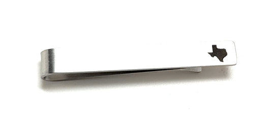 Silver tie clip with Texas state outline on a white background
