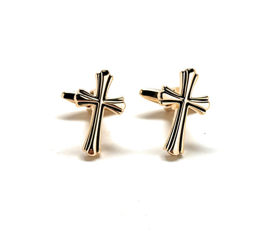Pair of gold cross earrings on a white background