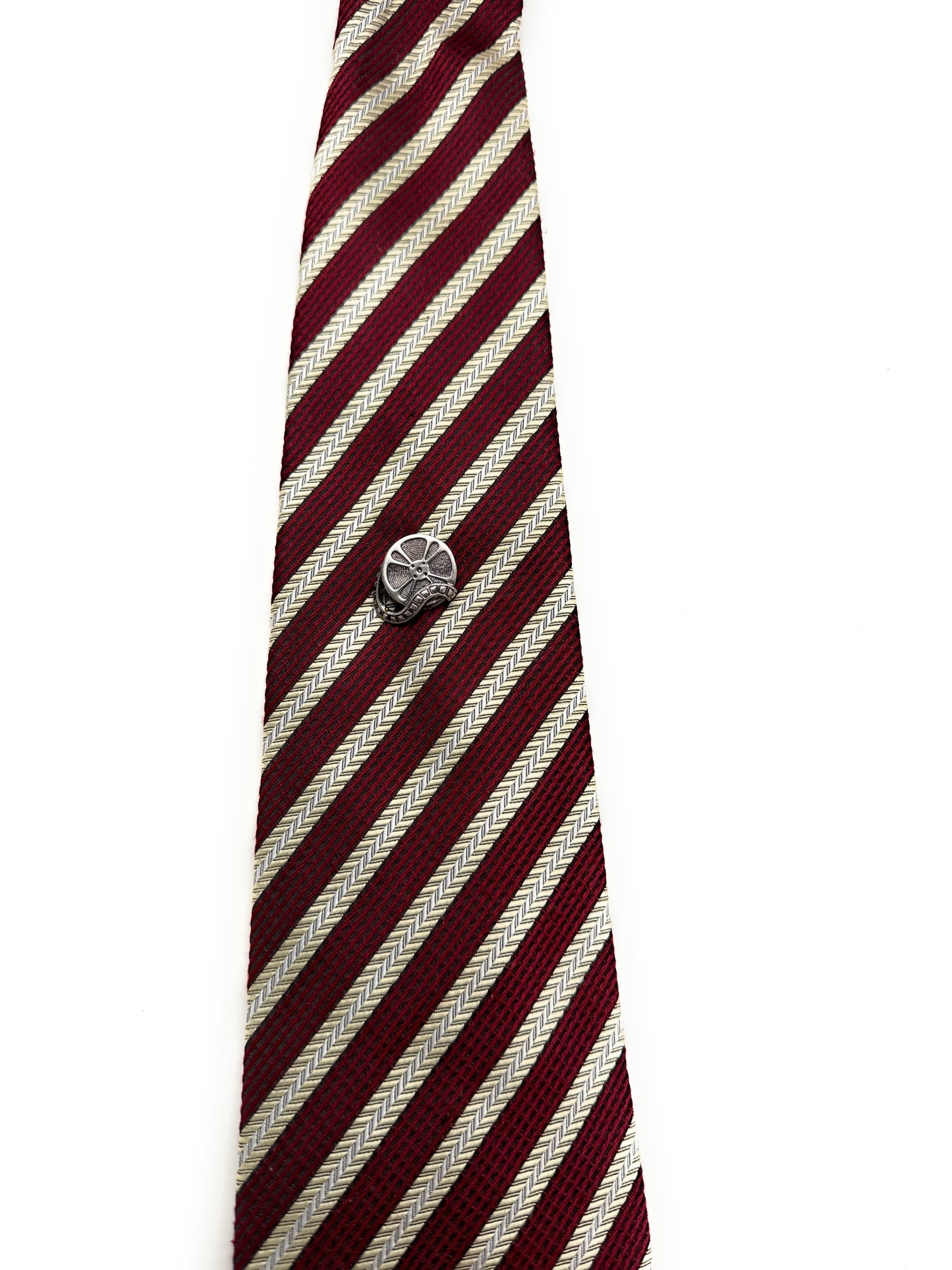 Maroon and white striped tie with a silver clasp on a white background