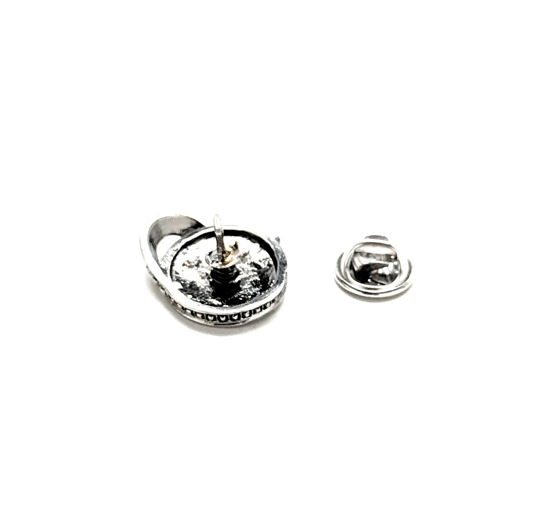 Silver earring on a white background