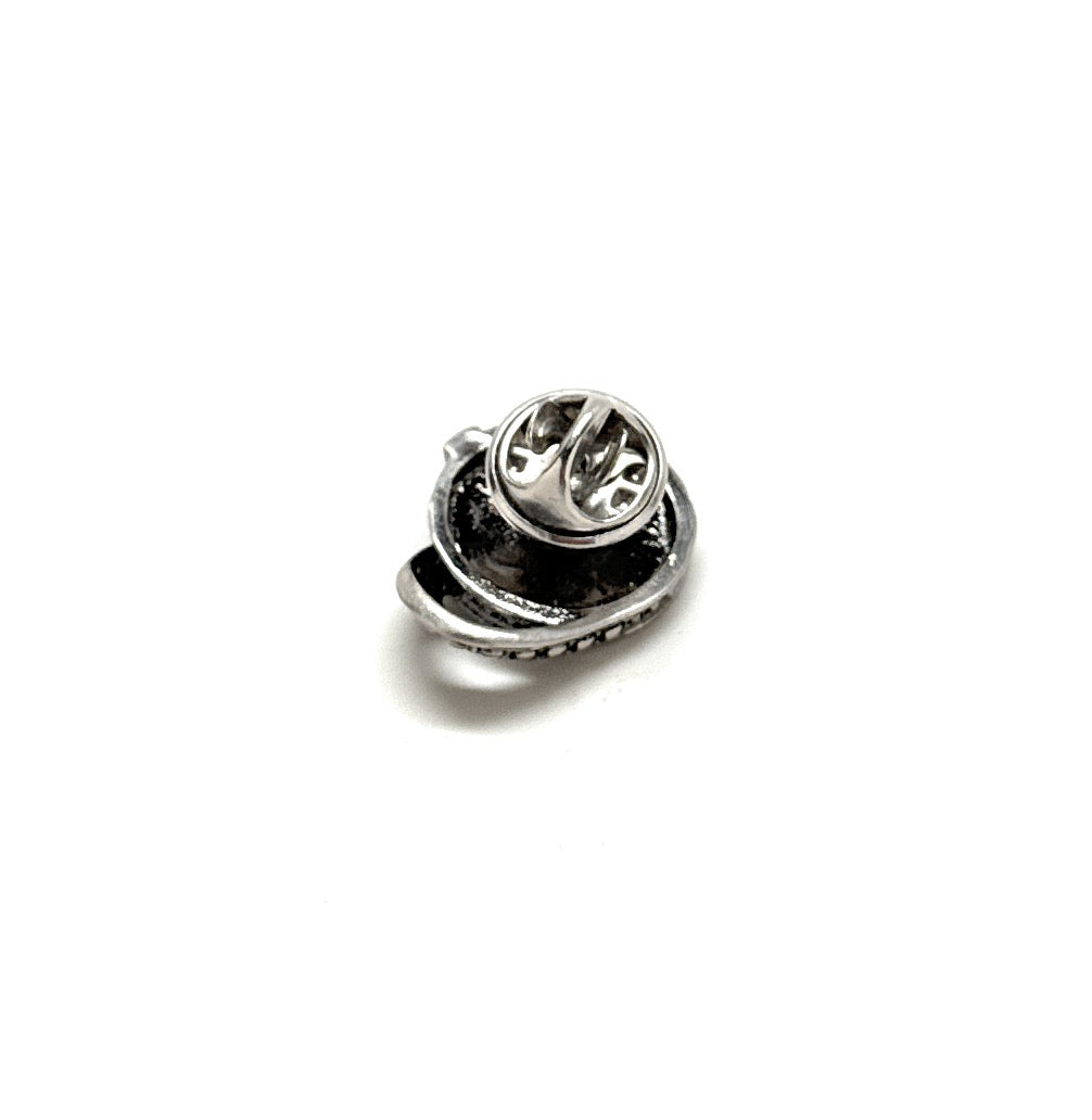 Silver lapel pin on a white background