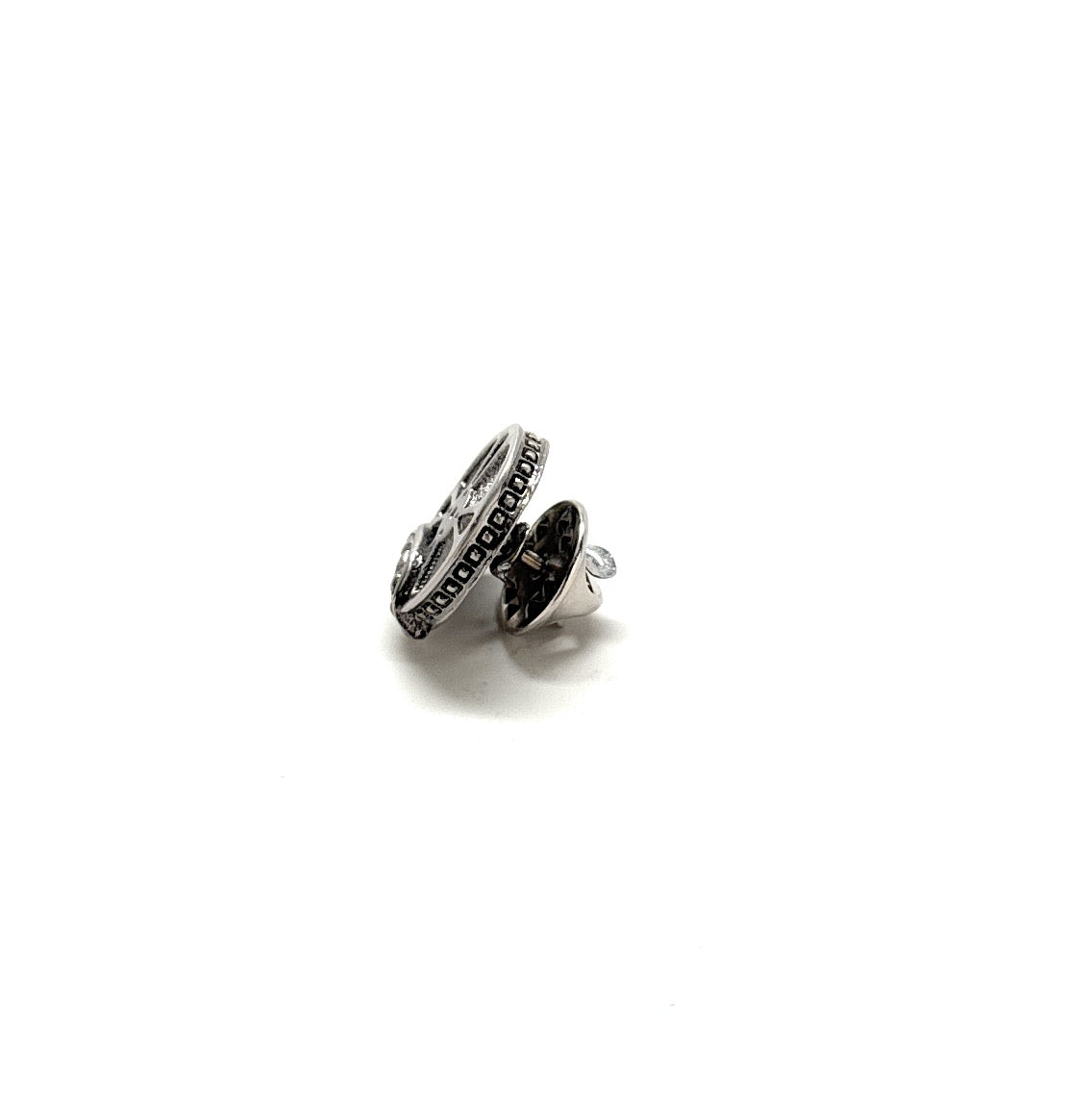 Silver ring with black gemstones on a white background