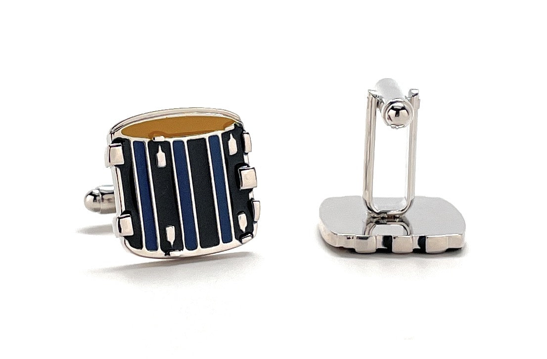 Cufflinks with a drum design on a white background