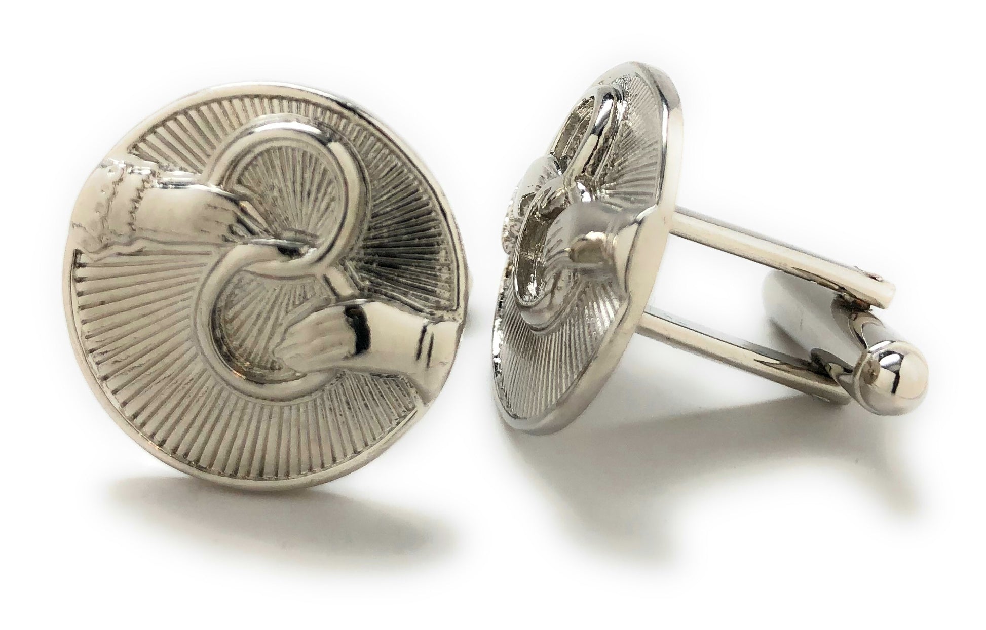 Silver cufflinks on a white background