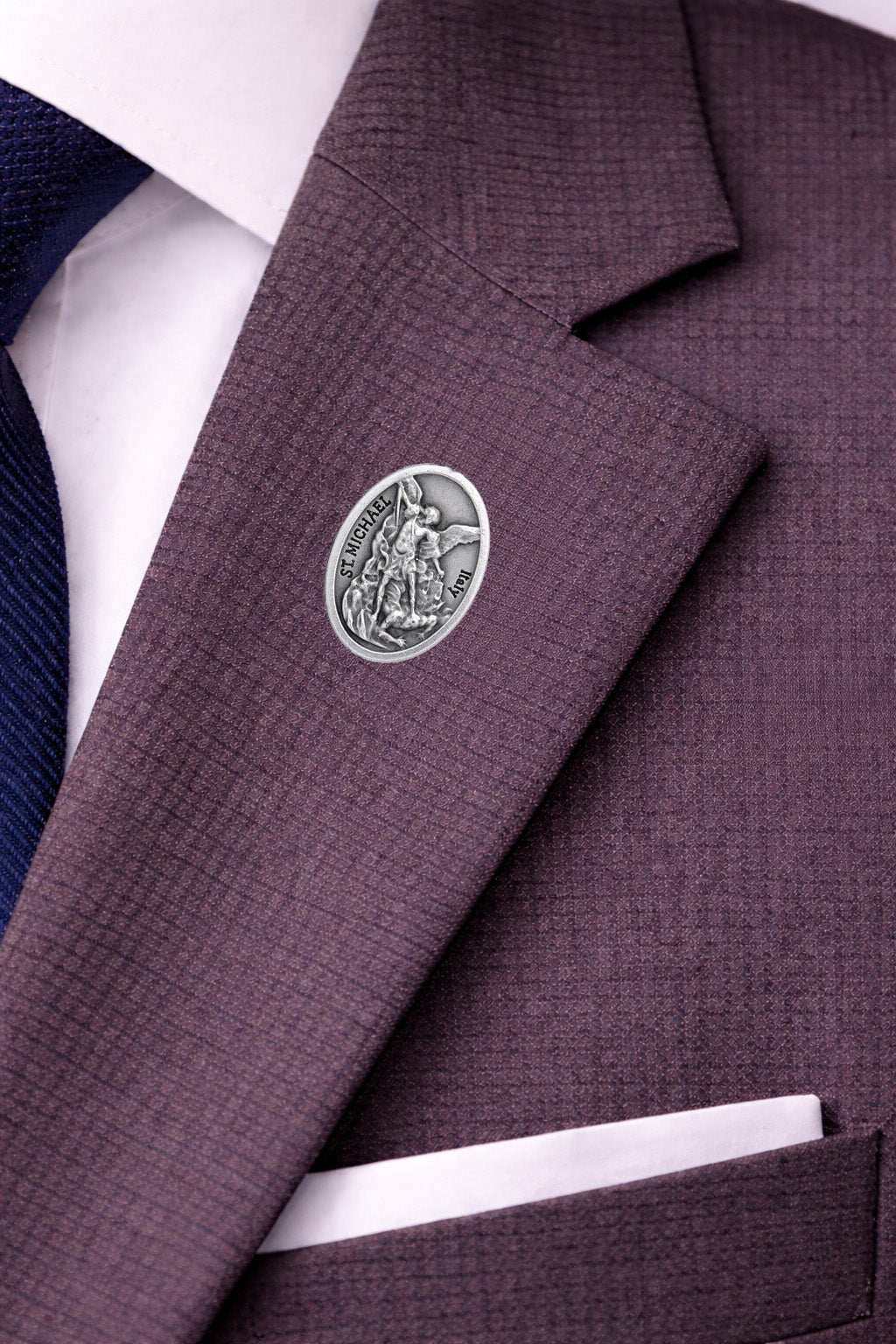 Italian made St. Michael Archangel devotional pin close-up gray suit