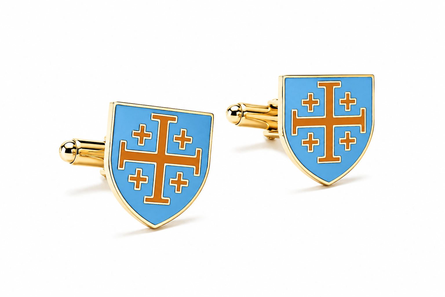 A pair of gold cufflinks shaped like shields with a light blue enamel background and an orange cross design, shown on a clean white background.