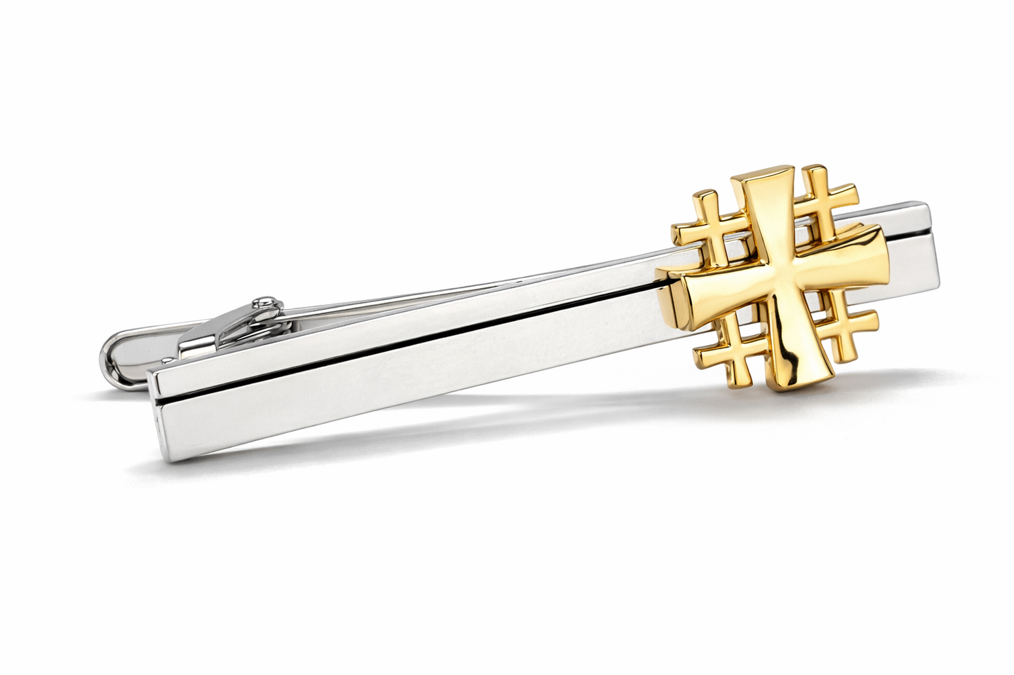 Gold and silver Jerusalem Cross tie clip on a white background