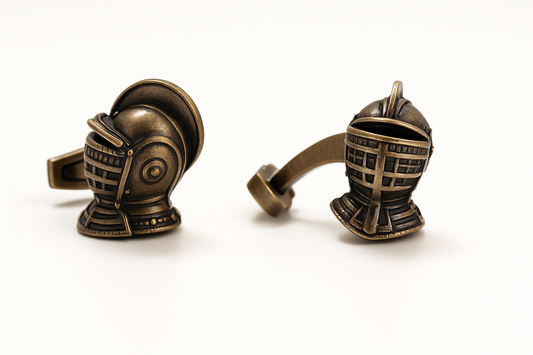Bronze helmet-shaped cufflinks on a white background