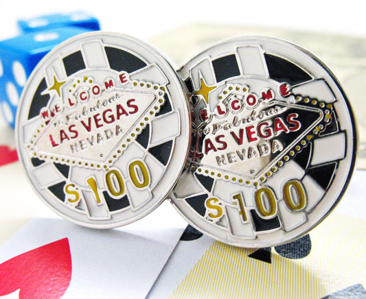 Two coins with 'Welcome to Fabulous Las Vegas Nevada S$100' text on a colorful background.