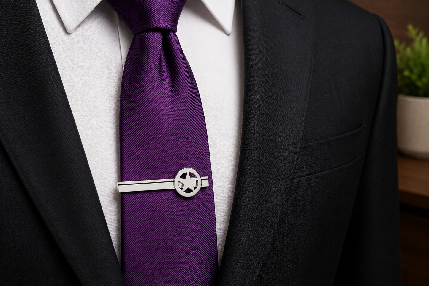 Silver Lone Star Tie Clip for Men with polished Texas star design and black accent stripe on a white background. Purple tie with suit