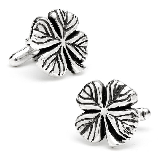 Silver four-leaf clover cufflinks on a white background
