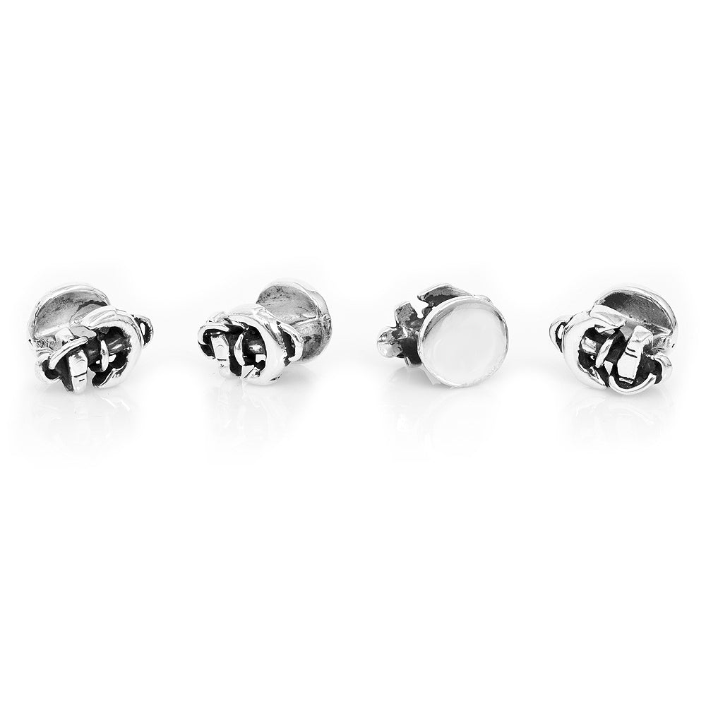 Set of four silver stud earrings on a white background
