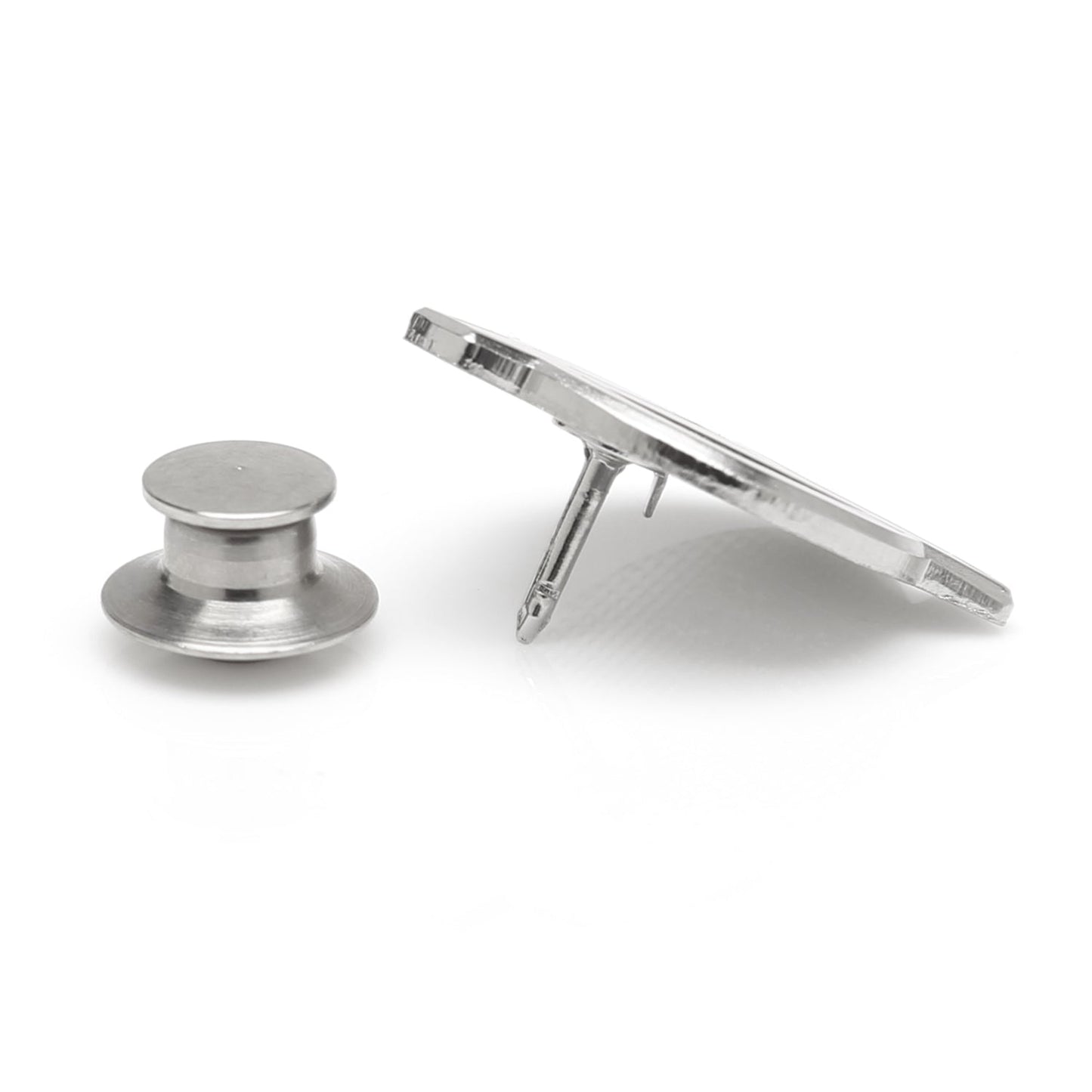 Metallic spool and bobbin on a white background